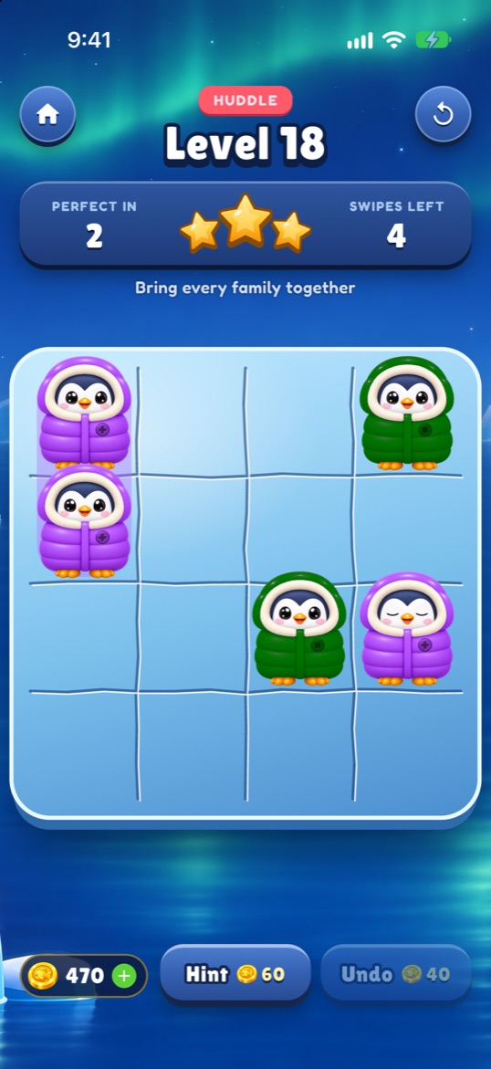 A Huddle level: purple and green penguins on a carved ice board, with Perfect in 2 and Swipes left 4.